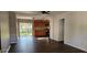 Bright living room with dark hardwood floors and access to the backyard at 301 3Rd Sw Ave, Largo, FL 33770