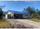 One-story house with tarp-covered roof, needs repairs at 3120 Smith Ave, Bradenton, FL 34207