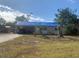 One-story house with tarp-covered roof, needs repairs at 3120 Smith Ave, Bradenton, FL 34207