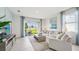 Bright living room with sliding glass doors leading to backyard at 31540 Ancient Sage Rd, Wesley Chapel, FL 33545