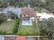 Aerial view of house, pool, and surrounding neighborhood at 3213 W Fair Oaks Ave, Tampa, FL 33611
