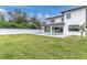 Spacious backyard with a large pool and a white fence at 3213 W Fair Oaks Ave, Tampa, FL 33611