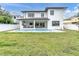 Home with a large backyard, grassy lawn and a refreshing pool at 3213 W Fair Oaks Ave, Tampa, FL 33611