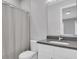 Modern bathroom with white vanity and shower/tub combo at 3213 W Fair Oaks Ave, Tampa, FL 33611