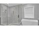 Luxurious bathroom with a large walk-in shower and soaking tub at 3213 W Fair Oaks Ave, Tampa, FL 33611