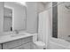 Modern bathroom with grey vanity and shower/tub combo at 3213 W Fair Oaks Ave, Tampa, FL 33611