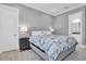 Bedroom with king-size bed and ensuite bathroom access at 3213 W Fair Oaks Ave, Tampa, FL 33611