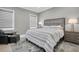 Comfortable guest bedroom with a striped comforter and nightstand at 3213 W Fair Oaks Ave, Tampa, FL 33611