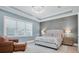Bright bedroom featuring a king-size bed and calming palette at 3213 W Fair Oaks Ave, Tampa, FL 33611