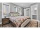 Bright bedroom with king-size bed and ensuite bathroom access at 3213 W Fair Oaks Ave, Tampa, FL 33611