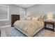 King-size bed in a well-lit bedroom with wood floors at 3213 W Fair Oaks Ave, Tampa, FL 33611