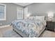 Bedroom with king-size bed, neutral decor, and wood floors at 3213 W Fair Oaks Ave, Tampa, FL 33611