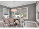 Elegant dining room featuring a round table and comfortable chairs at 3213 W Fair Oaks Ave, Tampa, FL 33611