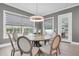 Bright dining room with a large table and chairs, and access to the backyard at 3213 W Fair Oaks Ave, Tampa, FL 33611