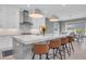 Modern kitchen with white cabinets, stainless steel appliances, and large island at 3213 W Fair Oaks Ave, Tampa, FL 33611