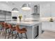 Modern kitchen with white cabinets, stainless steel appliances, and wine cooler at 3213 W Fair Oaks Ave, Tampa, FL 33611