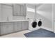 Convenient laundry room with ample storage and modern appliances at 3213 W Fair Oaks Ave, Tampa, FL 33611