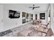 Spacious covered patio with seating and outdoor TV at 3213 W Fair Oaks Ave, Tampa, FL 33611