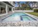 Inviting pool with spa and surrounding patio at 3213 W Fair Oaks Ave, Tampa, FL 33611