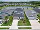 Two-story home with lake view and landscaped yard at 3322 Woodmont Dr, Parrish, FL 34219