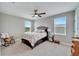 Cozy bedroom with a queen-size bed and rocking chair at 3322 Woodmont Dr, Parrish, FL 34219