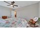 Spacious bedroom with a king-size bed and rocking chair at 3322 Woodmont Dr, Parrish, FL 34219