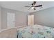 Bright bedroom with ceiling fan and access to other rooms at 3322 Woodmont Dr, Parrish, FL 34219