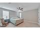 Spacious bedroom with ceiling fan and rocking chair at 3322 Woodmont Dr, Parrish, FL 34219
