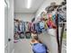 Large walk-in closet with ample shelving and hanging space at 3322 Woodmont Dr, Parrish, FL 34219