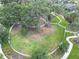 Aerial view of a community park with walking paths and green space at 3322 Woodmont Dr, Parrish, FL 34219