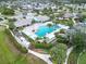 Aerial view of community pool, spa, and clubhouse at 3322 Woodmont Dr, Parrish, FL 34219