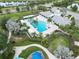 Community pool, spa, and clubhouse with lounge chairs at 3322 Woodmont Dr, Parrish, FL 34219