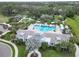 Community pool and clubhouse with lush landscaping at 3322 Woodmont Dr, Parrish, FL 34219