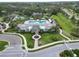 Community pool and clubhouse with lush landscaping at 3322 Woodmont Dr, Parrish, FL 34219