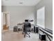 Spacious home office with a large desk and window at 3322 Woodmont Dr, Parrish, FL 34219