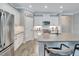 Spacious kitchen with white cabinets and a large island at 3322 Woodmont Dr, Parrish, FL 34219