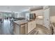 Open kitchen with stainless steel appliances and views to living area at 3322 Woodmont Dr, Parrish, FL 34219