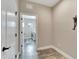 Laundry room with access from hallway at 3322 Woodmont Dr, Parrish, FL 34219