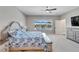 Large main bedroom with water view and plenty of natural light at 3322 Woodmont Dr, Parrish, FL 34219