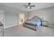 Spacious main bedroom with ensuite bathroom and ceiling fan at 3322 Woodmont Dr, Parrish, FL 34219