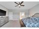 Main bedroom with large TV and ensuite bathroom at 3322 Woodmont Dr, Parrish, FL 34219