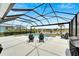 Enjoy this pool and spa with lake view at 3322 Woodmont Dr, Parrish, FL 34219