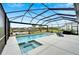 Screened pool and spa with lake view at 3322 Woodmont Dr, Parrish, FL 34219