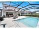Spacious pool area with covered patio at 3322 Woodmont Dr, Parrish, FL 34219