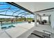 Covered patio with pool, spa, and outdoor seating at 3322 Woodmont Dr, Parrish, FL 34219
