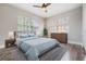 Well-lit bedroom with wood-look floors and dresser at 3409 E Comanche Ave, Tampa, FL 33610