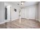 Bright bedroom with wood-look floors and access to bathroom at 3409 E Comanche Ave, Tampa, FL 33610