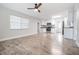 Modern kitchen with white cabinets, stainless steel appliances and wood floors at 3409 E Comanche Ave, Tampa, FL 33610