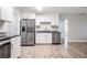 Modern kitchen featuring stainless steel appliances and granite countertops at 3409 E Comanche Ave, Tampa, FL 33610