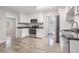 Modern kitchen with white cabinets, granite countertops and stainless steel appliances at 3409 E Comanche Ave, Tampa, FL 33610